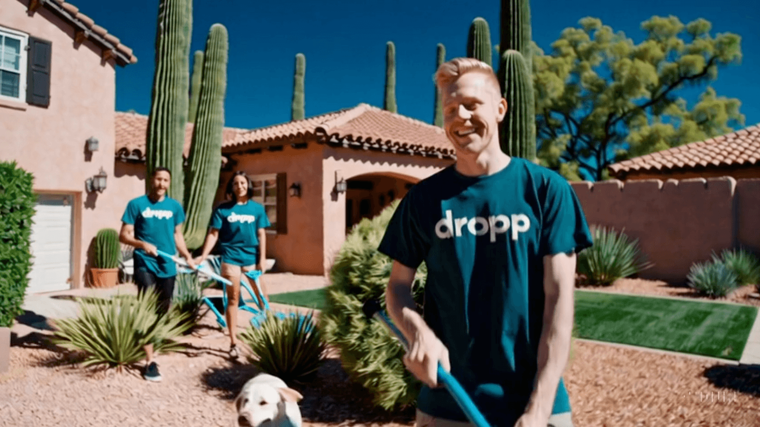 DROPP professional cleaning a yard with a happy dog in Arizona